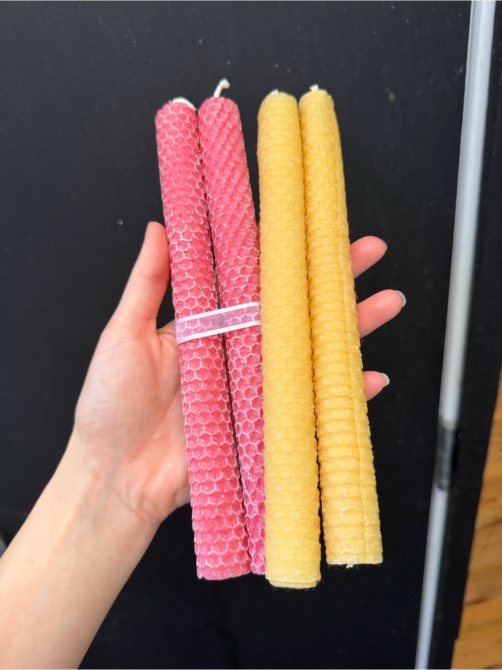 Hand-rolled pink and yellow honeycomb beeswax taper candles